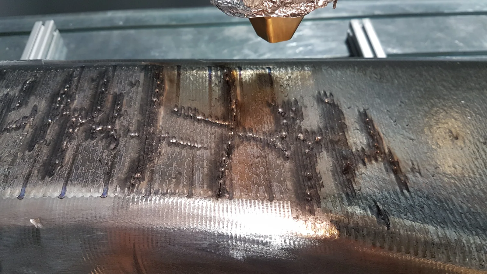 Used forging hammer working face with visible cracks and wear before LMD repair review