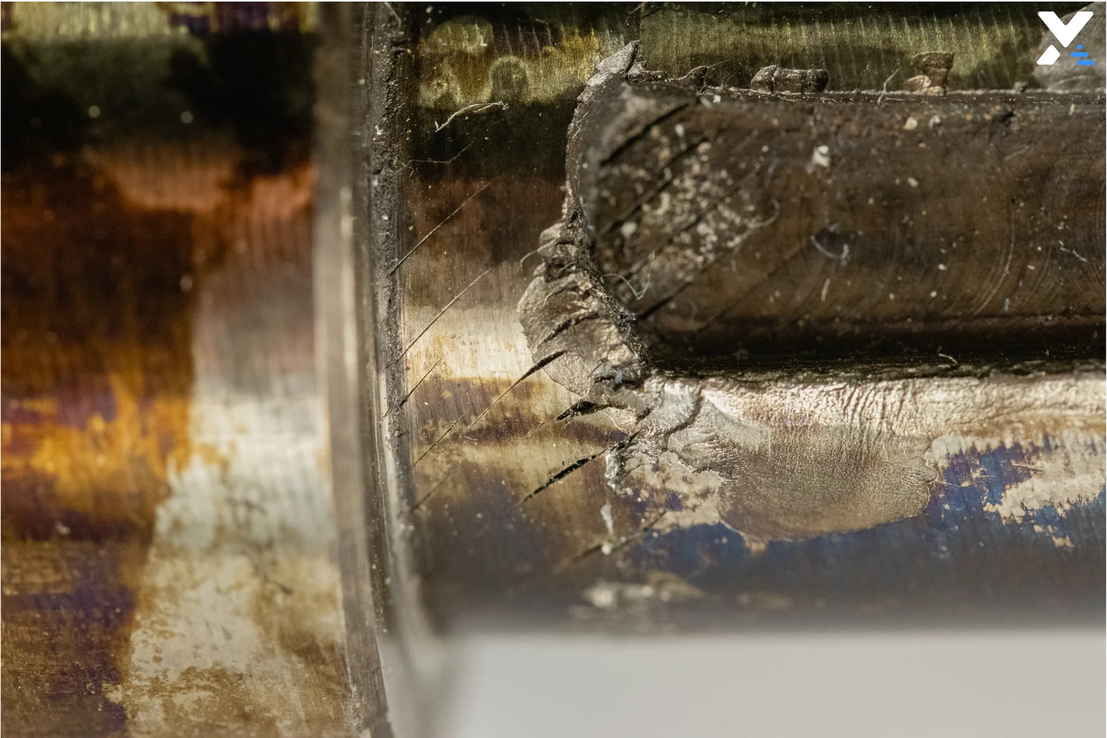 Detailed close-up of the extrusion screw defect zone before repair