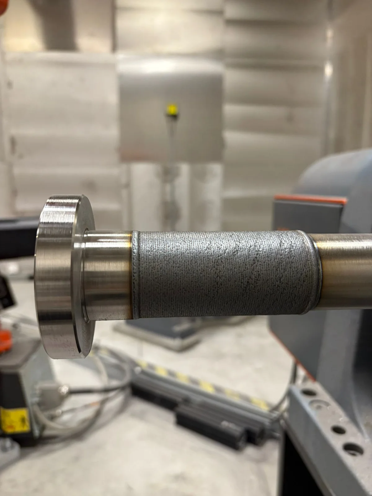 Close-up of the deposited Inconel 718 coating on the spindle