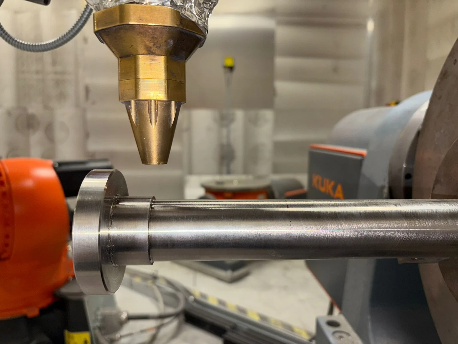 Spindle positioned in the LMD machine before Inconel 718 deposition